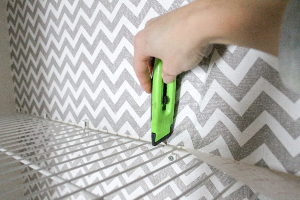 cutting contact paper around shelves