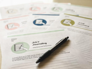 picture of printed monthly journal pages on a table