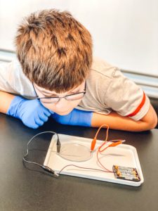 picture of a boy doing a science experiment