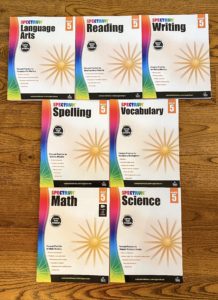 picture of spectrum workbooks laid out on floor