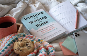 Parenting while Working from Home Book flatlay on white bed with coffee and cookie