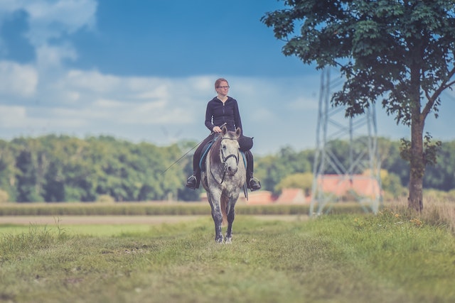 woman riding horse