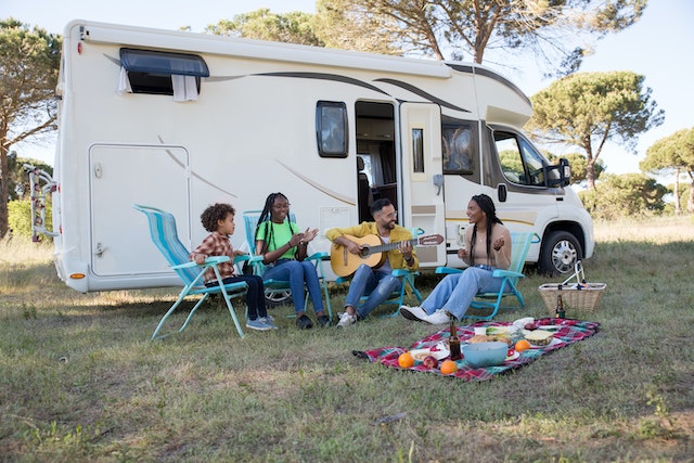 family in front of RV