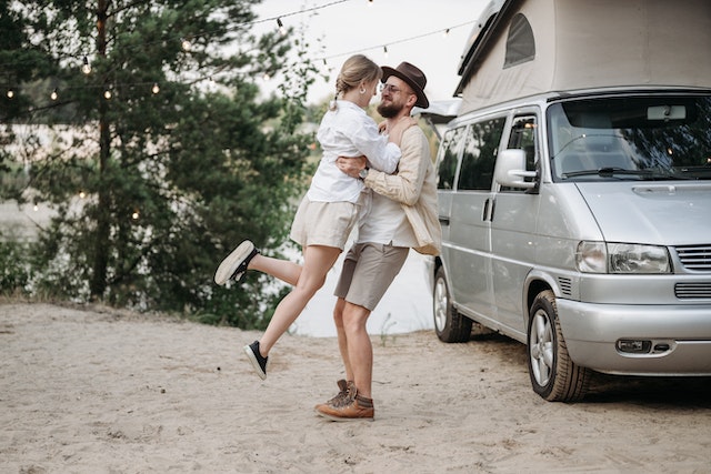 Happy couple in front of RV