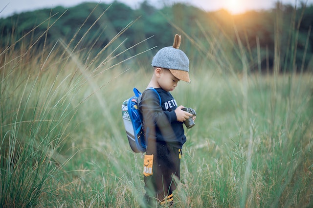 a boy out in a field