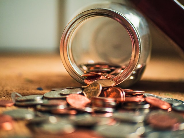 coins spilled out of money jar