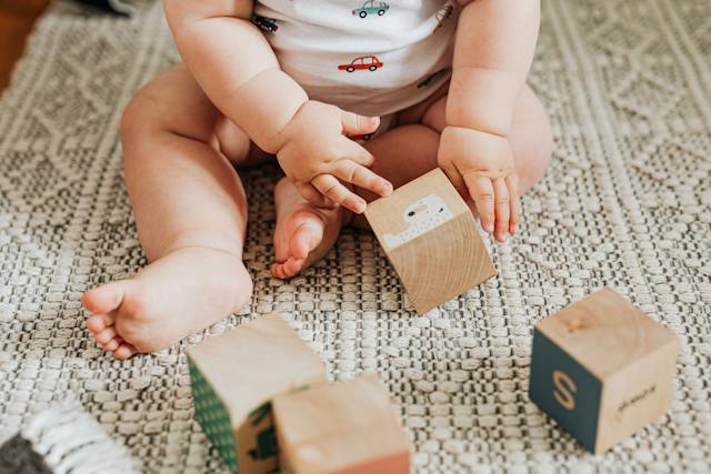 baby playing with blocks