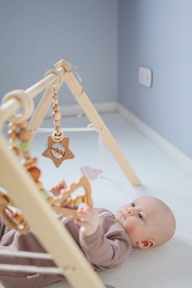 baby playing on playmat