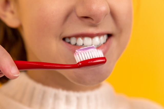 child brushing teeth