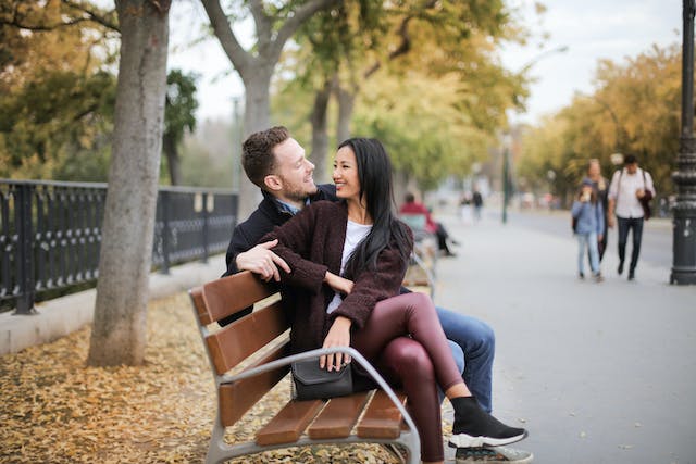 couple happy on bench