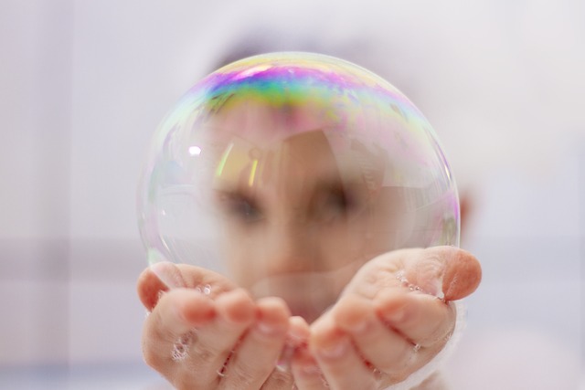 child holding large bubble