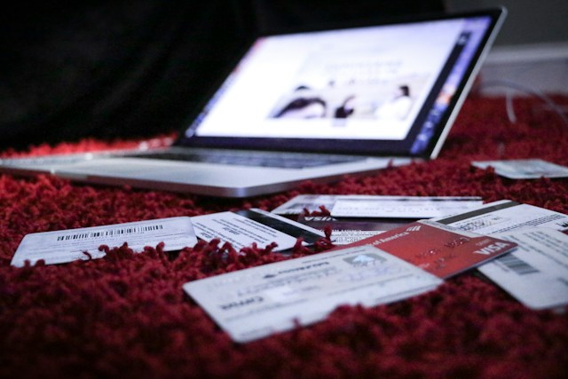 laptop with credit cards around it