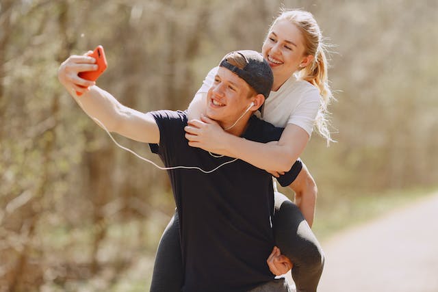 couple taking selfy while exercising