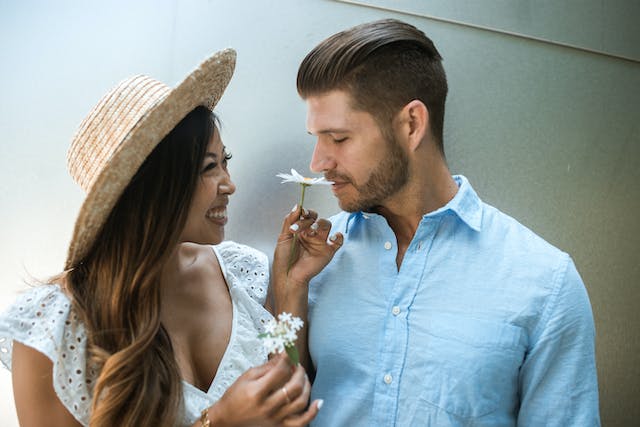 couple smelling flower