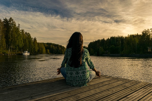 woman doing yoga on dock