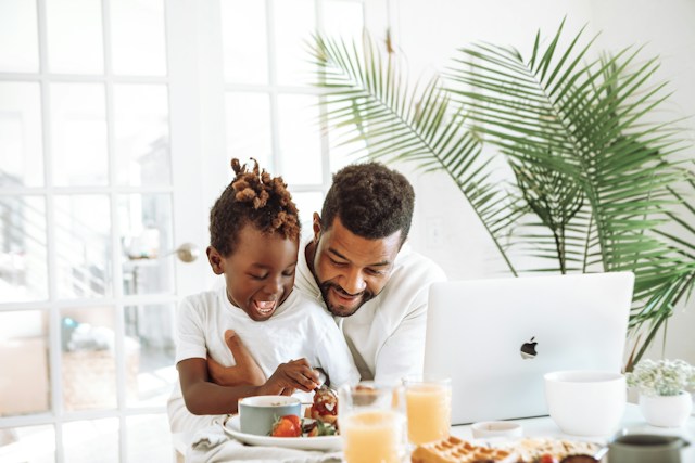 dad and son happy in kitchen