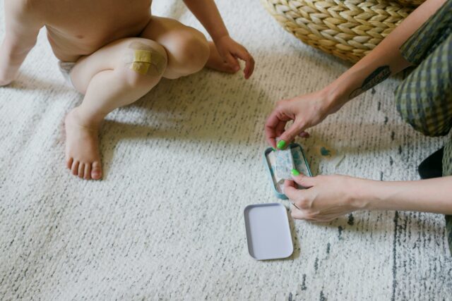 putting bandage on child