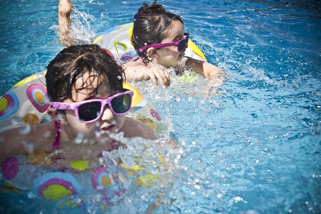 two young girls in pool