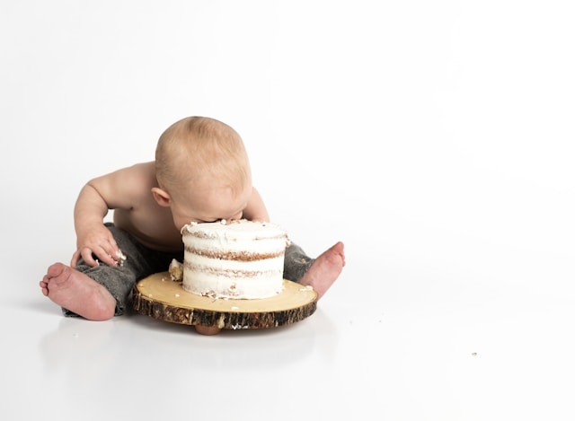 baby eating cake