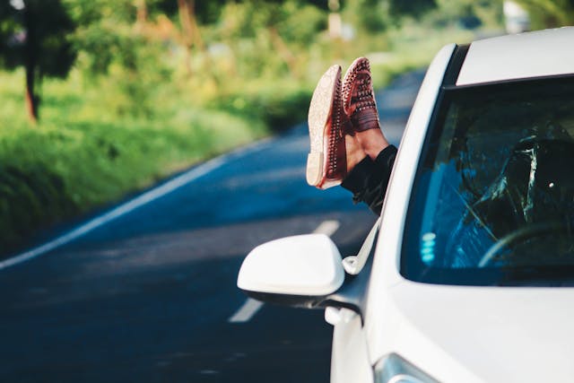 feet out car window