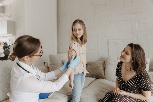 doctor checking child