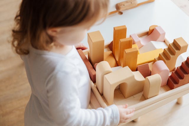 girl playing with blocks