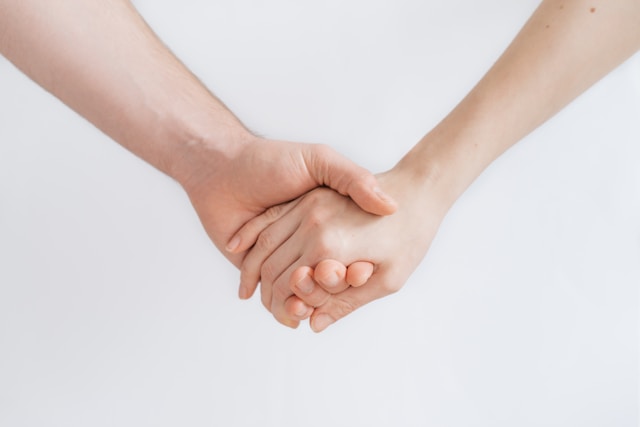 two people holding hands
