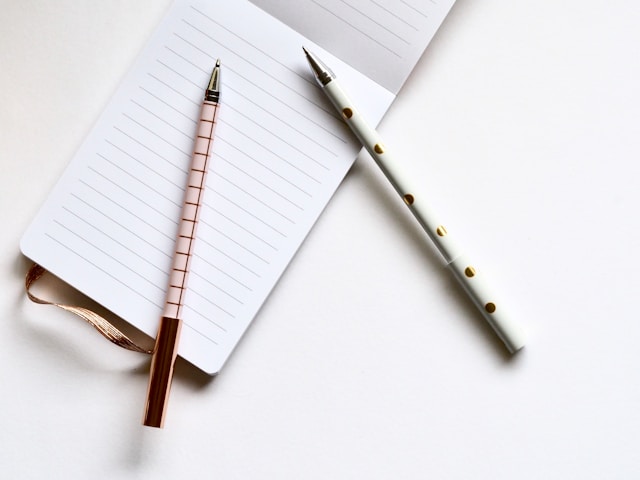 notepad with pens