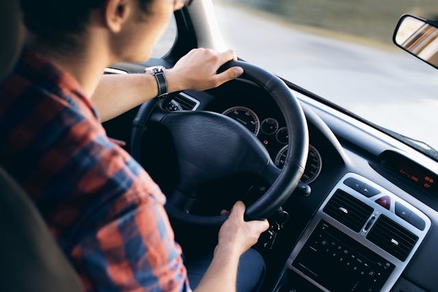 teen boy driving car
