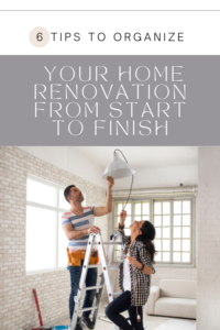 couple changing light fixture