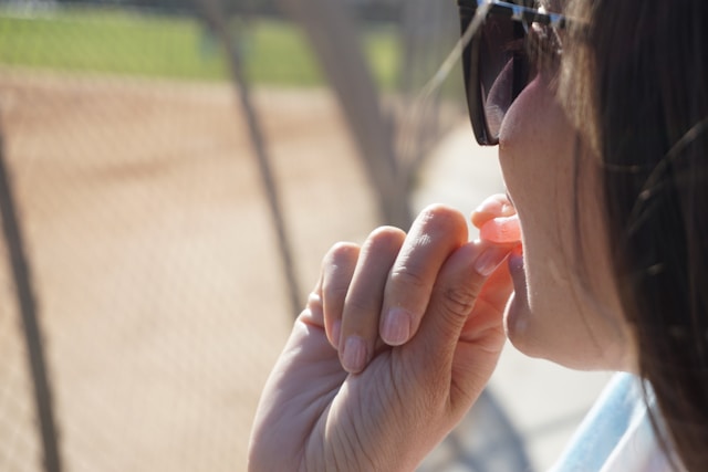 woman eating a gummy
