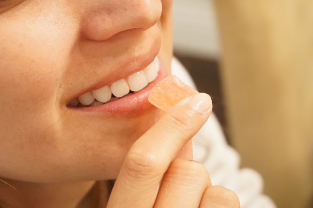 woman eating a gummy