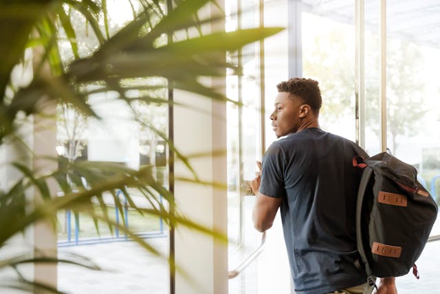 teen student leaving building