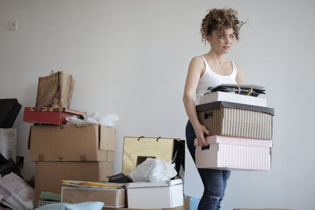 woman holding moving boxes