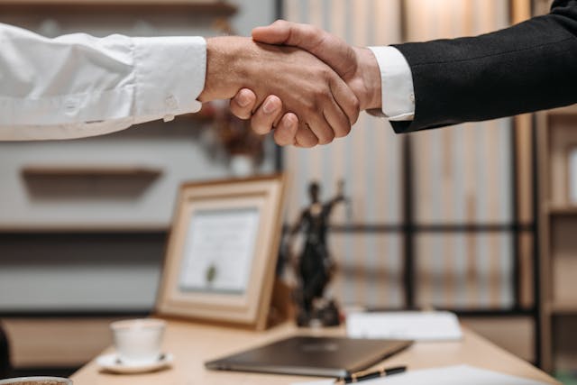 shaking hands in a law office