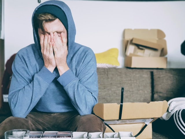 stressed out teen with head in hands