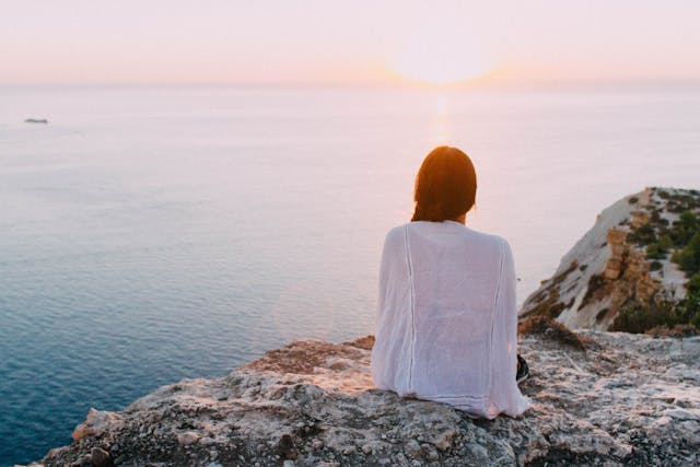 woman staring at water