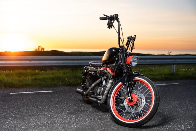 motorcycle parked at sunset