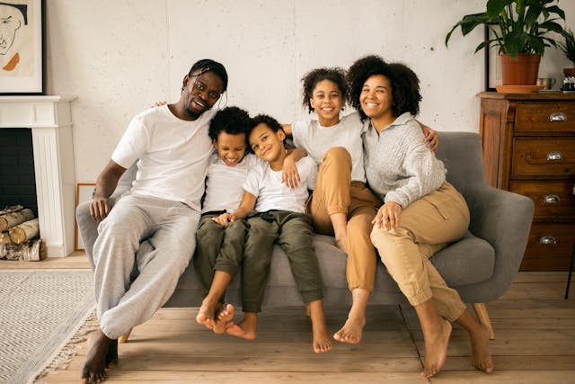 family sitting on courch