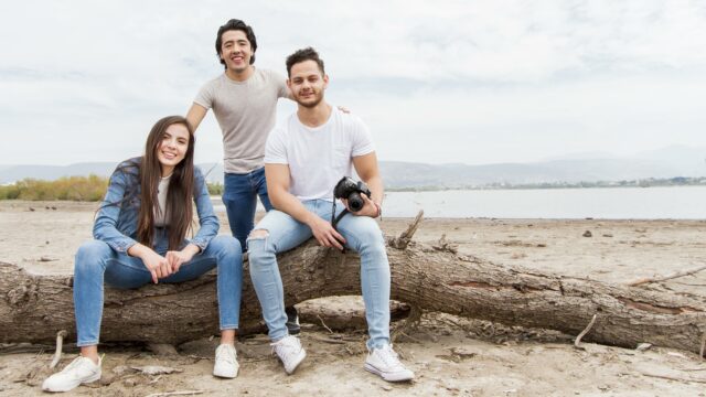 family posing on beach