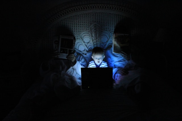 boy on computer at night