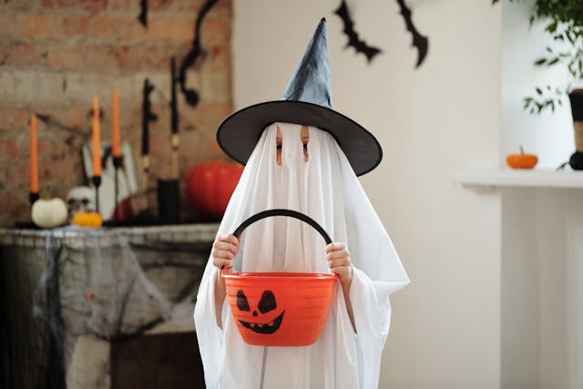 child trick or treating as ghost