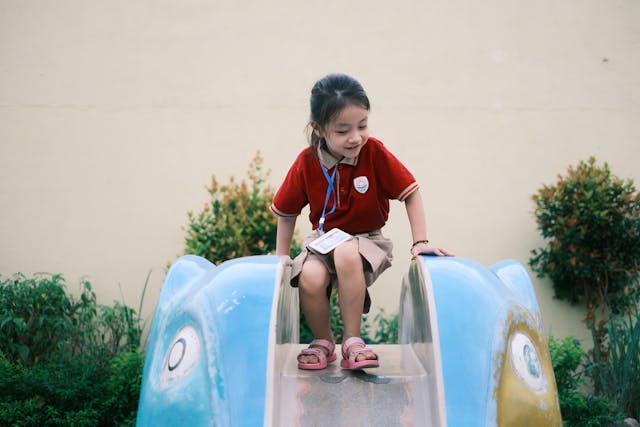 girl on school slide