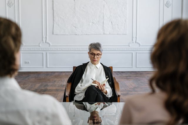 divorced couple meeting with professional