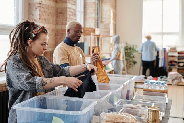 woman sorting through bins
