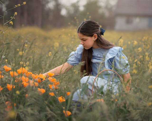 young girl in flower field