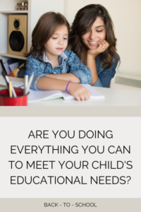 Mother helping daughter with homework