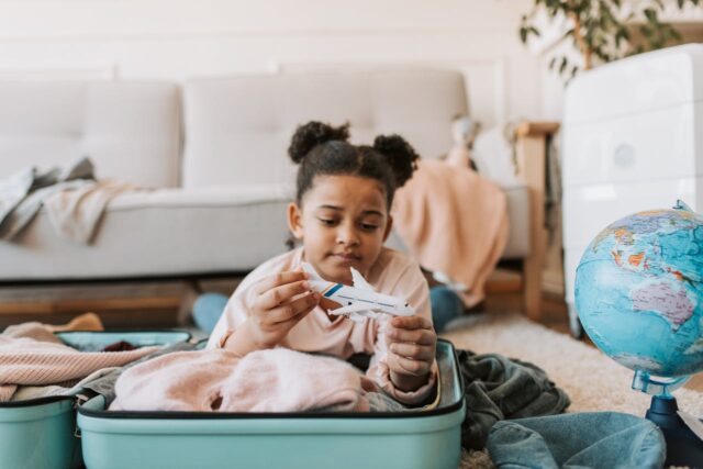 packing and plane helps with keeping kids happy, safe, and excited during an international move
