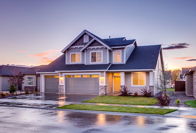 house at evening with lights on