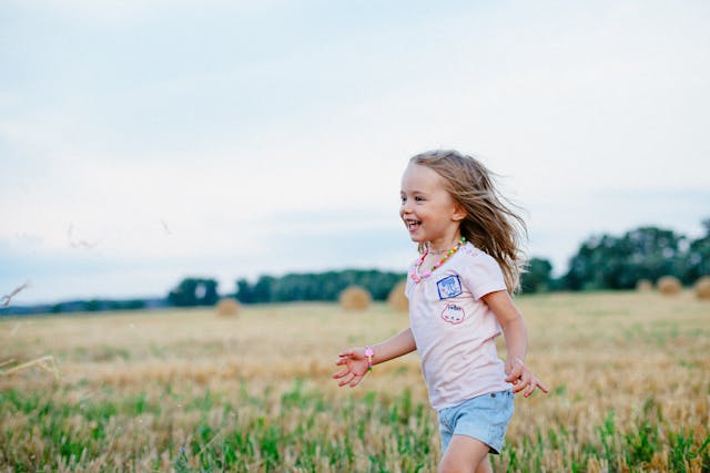 gril running in field